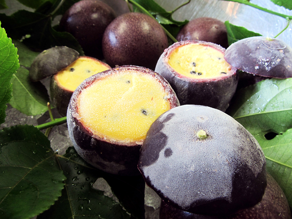Ice cream was stuffed in the skin of a passion fruit.